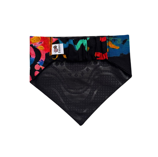 Black scrunchie dog bandana with colorful patterned border on a white background
