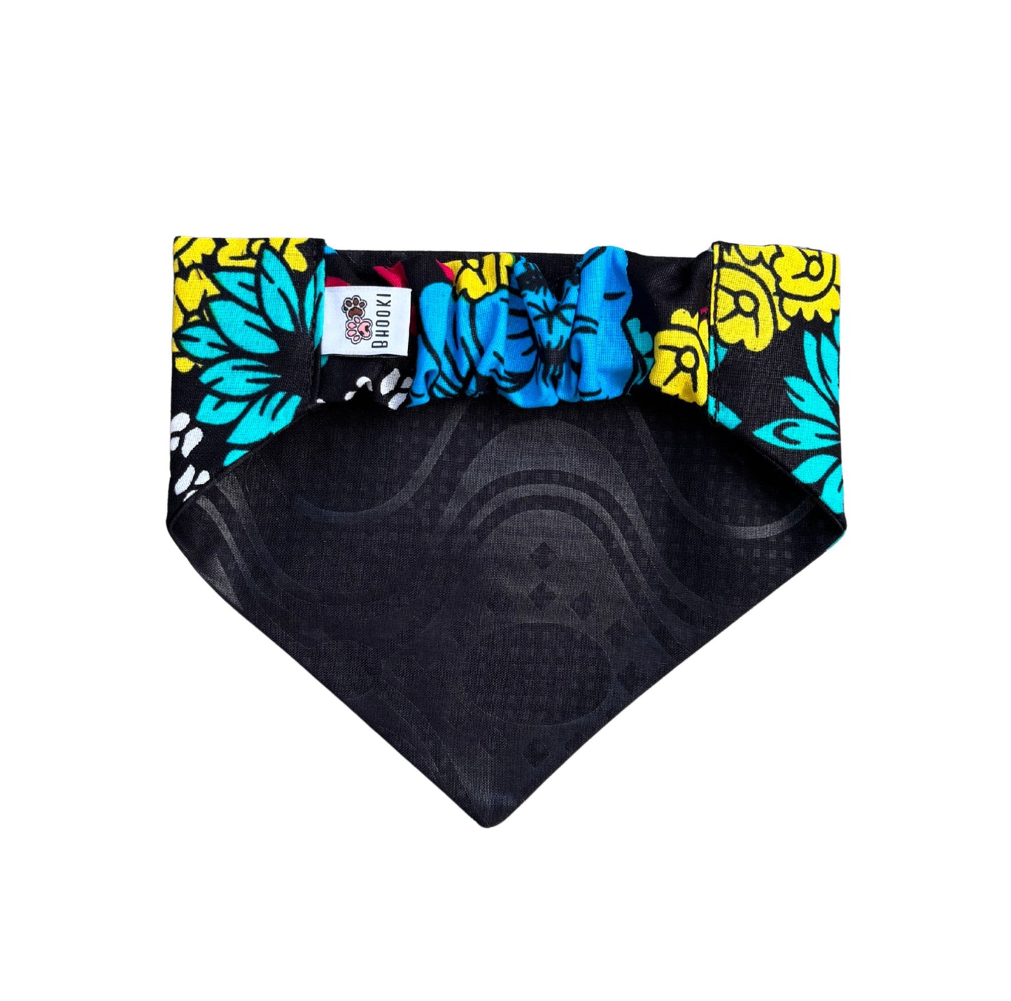 A scrunchie dog bandana with colorful floral pattern on a white background