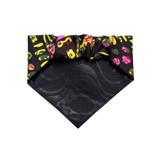 Black scrunchie dog bandana with colorful abstract pattern on a white background