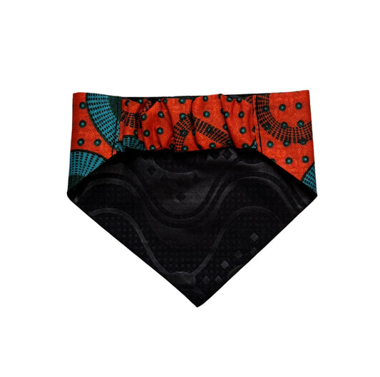 A dog bandana with colourful patterned on a white background