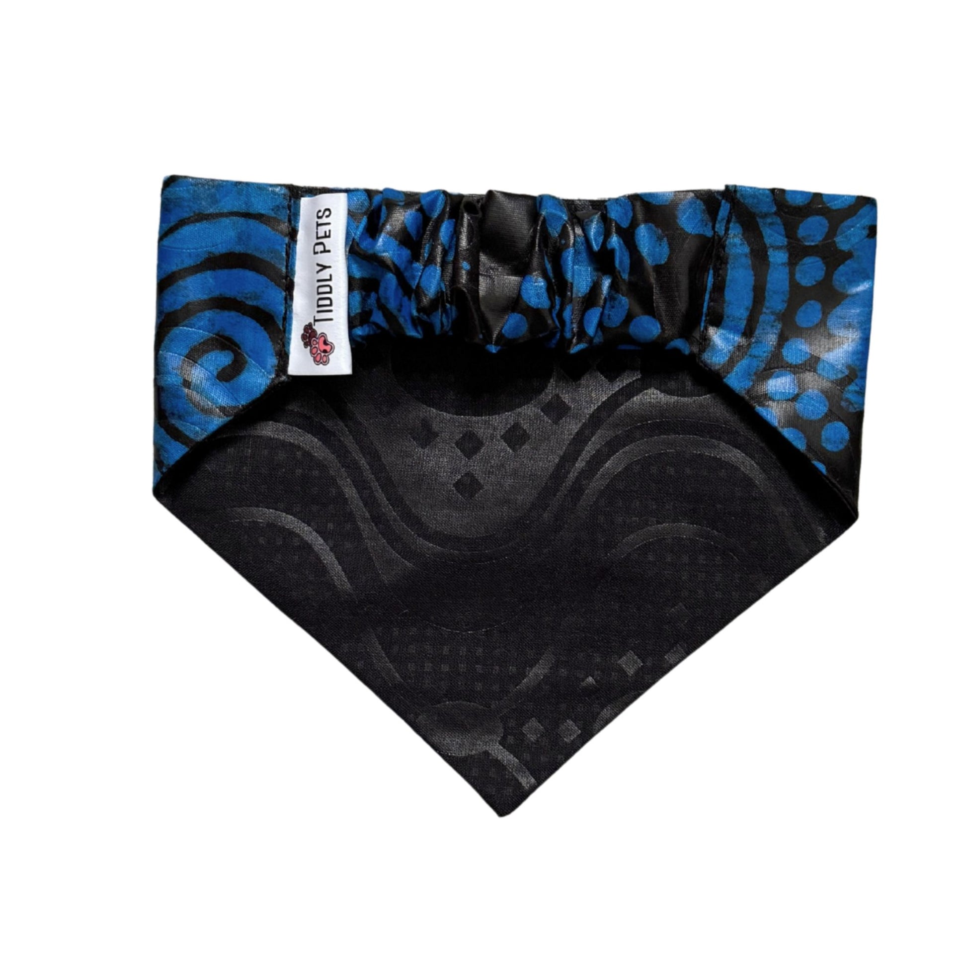 Black and blue patterned dog bandana with a visible brand label on a white background