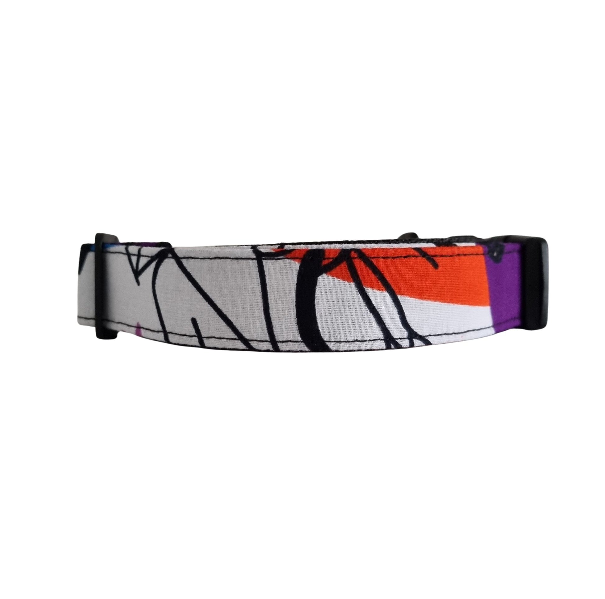 A multicolored geometric patterned dog collar.