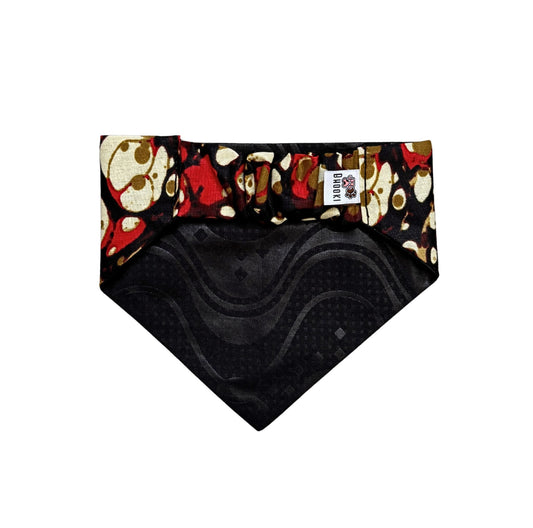 Dog bandana with skull and crossbones pattern on a white background