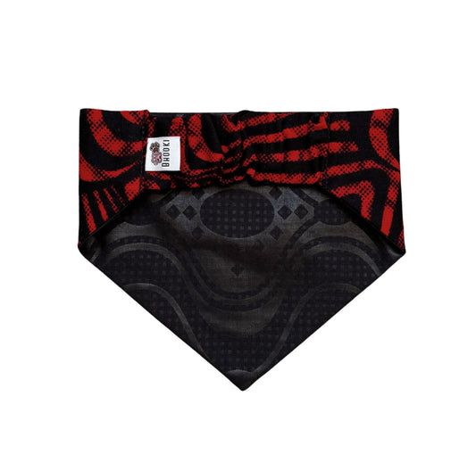 Black and red patterned scrunchie dof bandana with a brand label on a white background