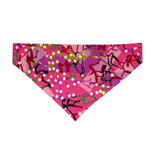 Pink bandana with black and white designs on a white background