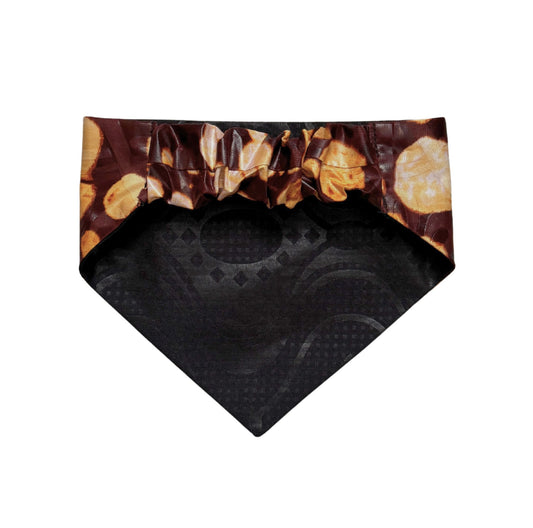 Black and brown patterned dog bandana on a white background