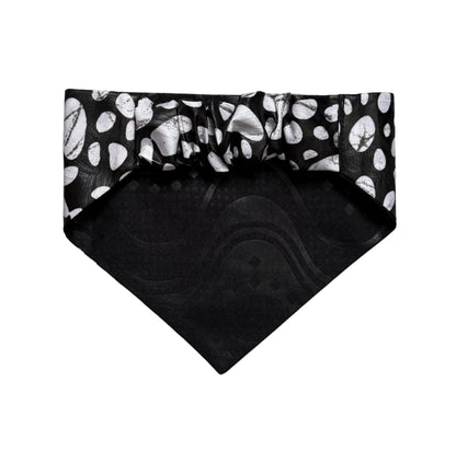 Black bandana with white polka dot like pattern on a white background
