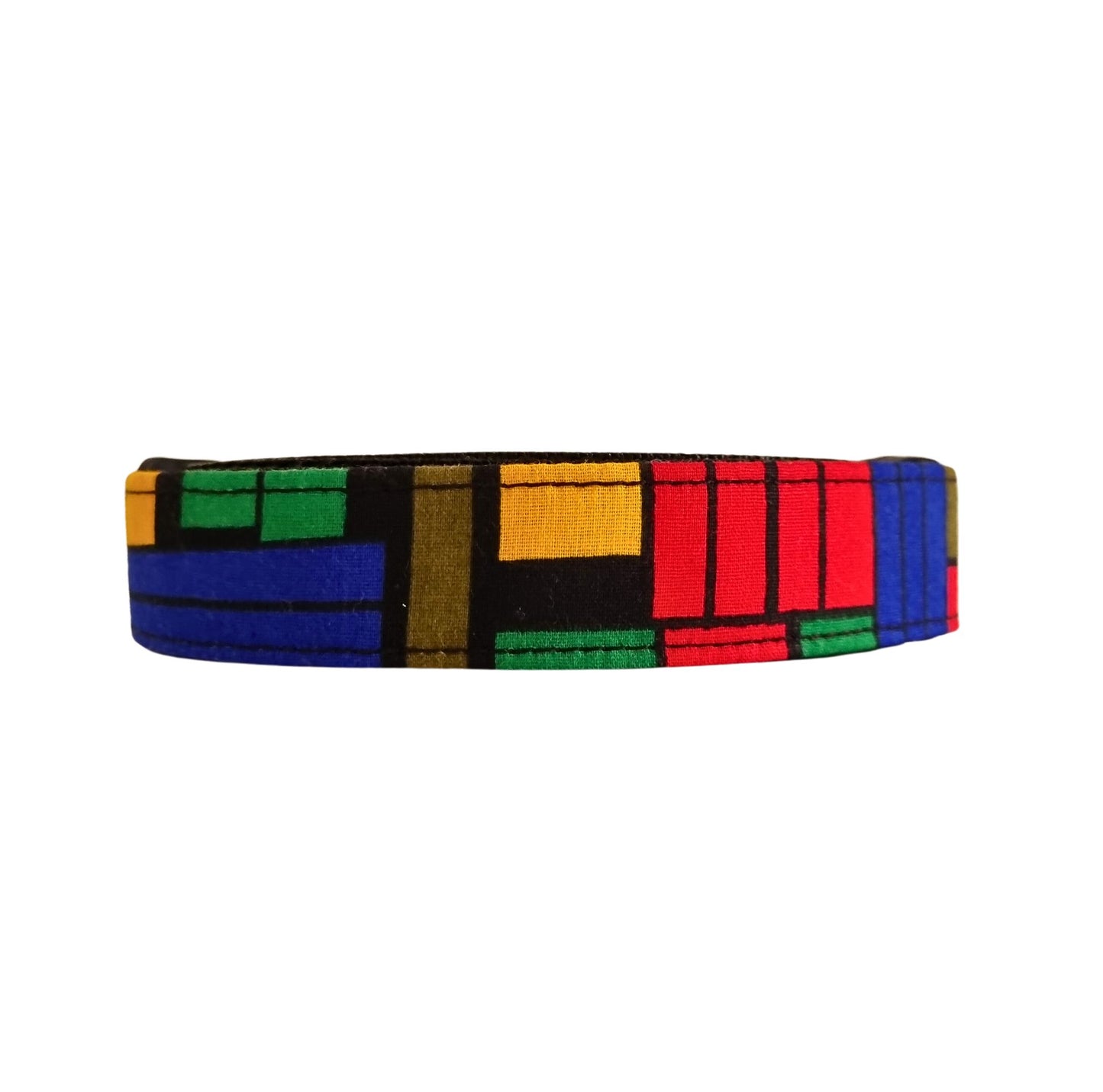 A multicolored geometric patterned dog collar.