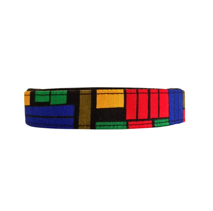 A multicolored geometric patterned dog collar.