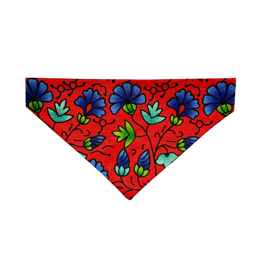 Red dog bandana with blue and green floral pattern on a white background