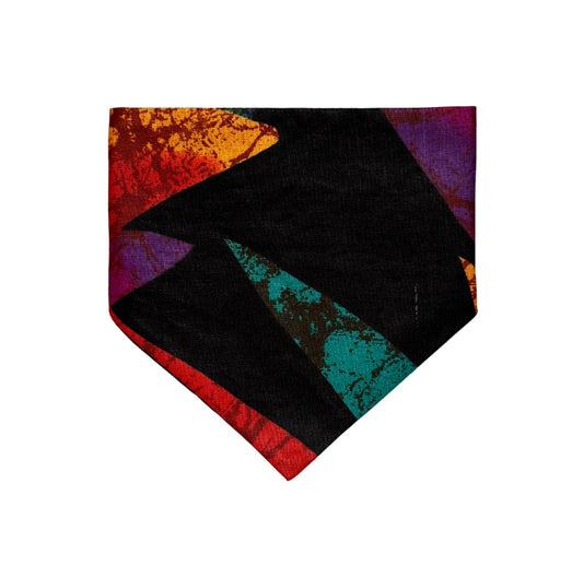 Colorful tie with geometric pattern dog bandana on a white background