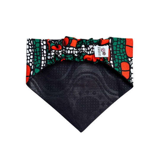 Colorful scrunchie dog bandana with geometric pattern on a white background