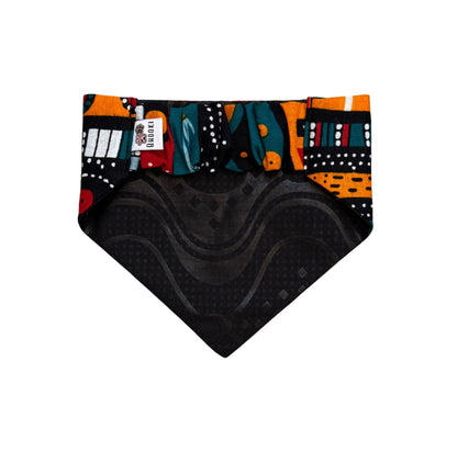Colorful patterned scrunchie dog bandana with black texture on a white background