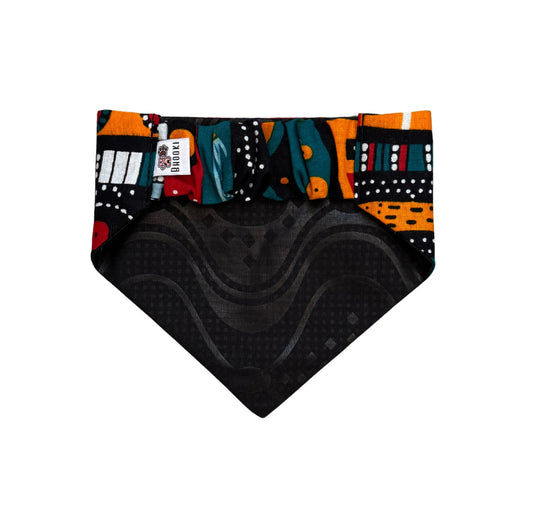 Colorful patterned scrunchie dog bandana with black texture on a white background