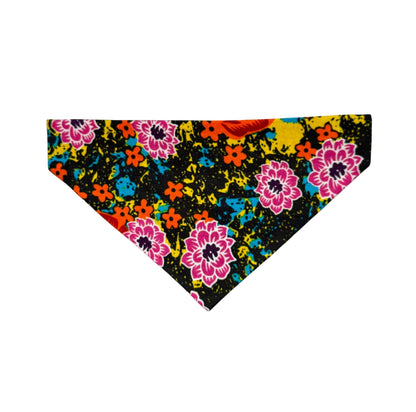 Colorful floral patterned dog bandana on a black background