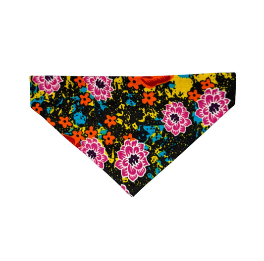 Colorful floral patterned dog bandana on a black background
